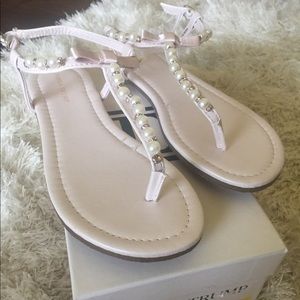 Ivanka Trump pearl and rhinestone thong sandals.